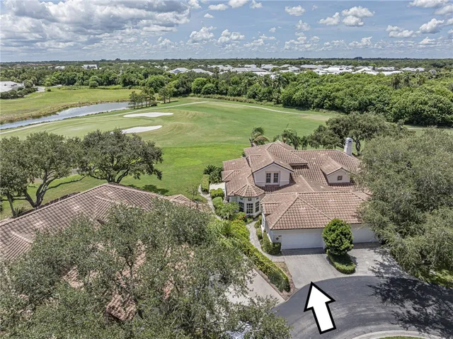 a view of a lake with a building in the background