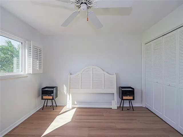 a view of a livingroom with a hardwood and a ceiling fan