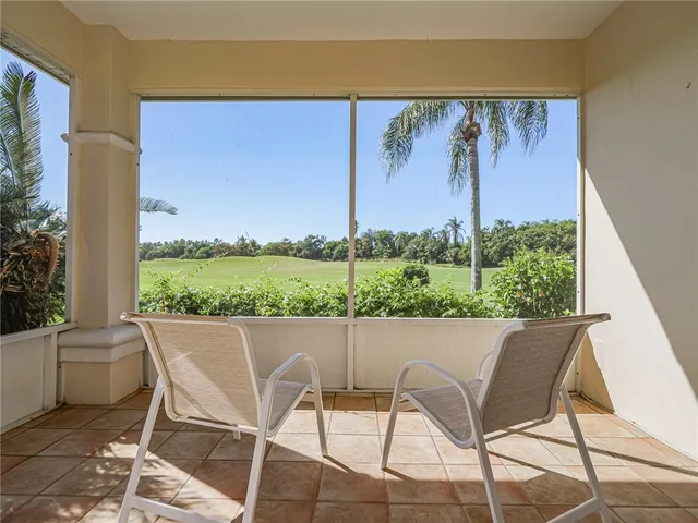 a view of chair and table in the room