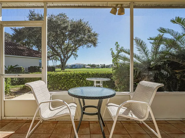 a view of a patio with a table chairs and a table