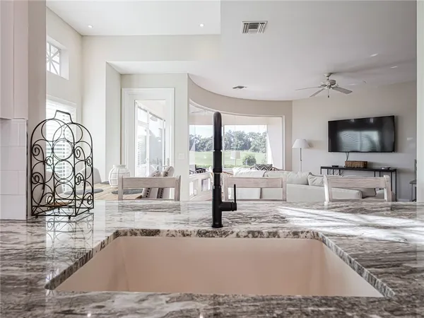 a living room with fireplace furniture and a flat screen tv
