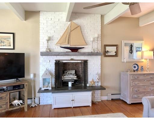 12 Long Beach Road Gloucester, MA 01930 - Photo 11 of 30 a living room with furniture and a flat screen tv