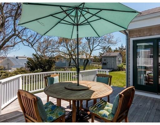 12 Long Beach Road Gloucester, MA 01930 - Photo 22 of 30 a view of a table and chairs under an umbrella