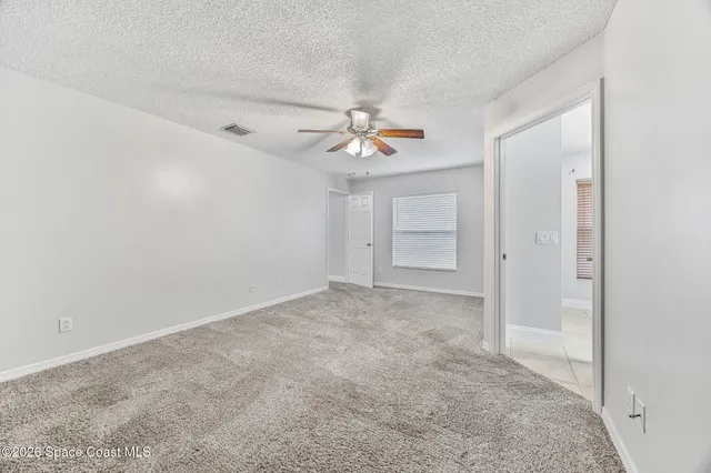 a bathroom with a granite countertop sink a mirror and a shower