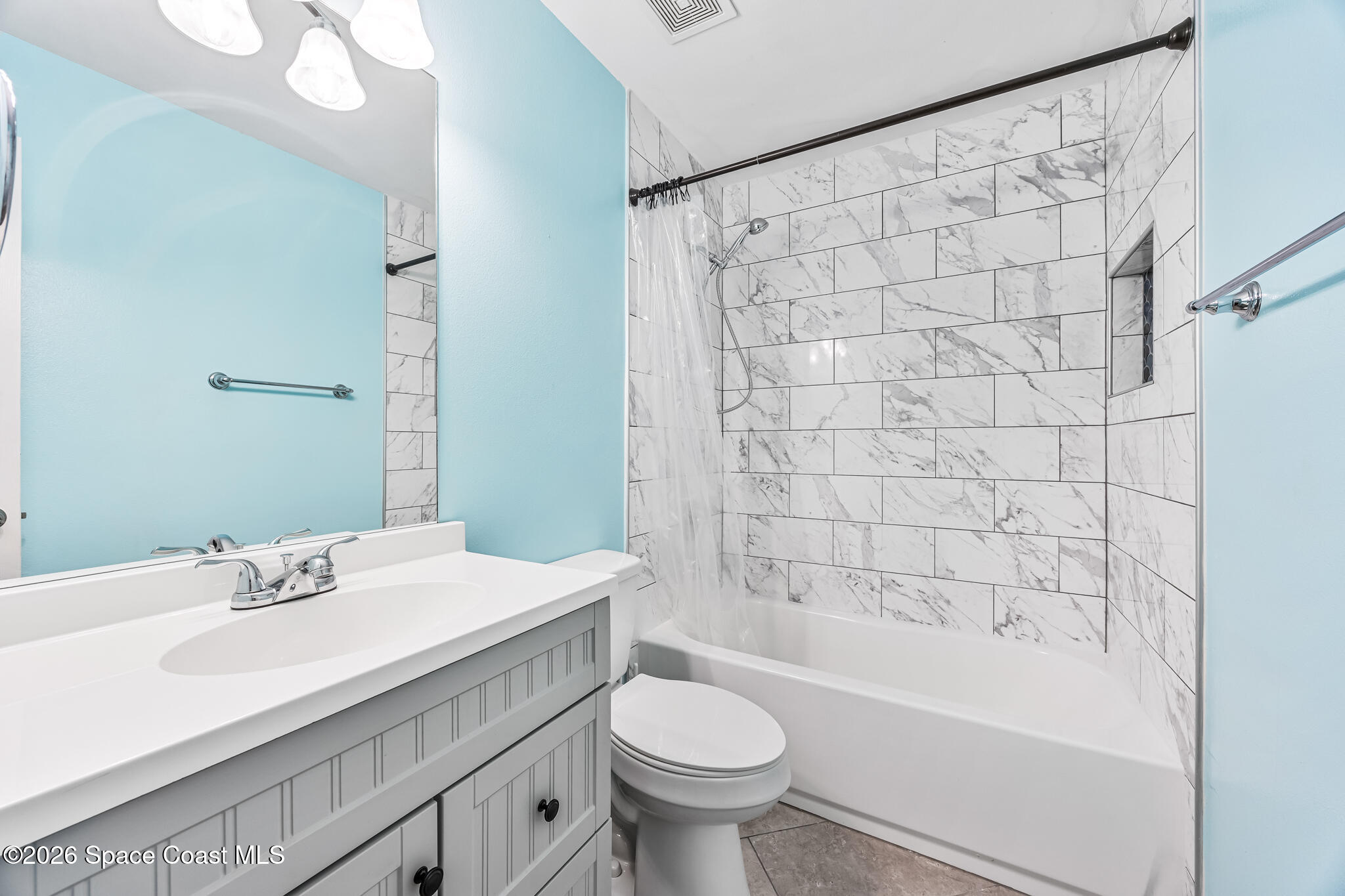 6185 Degan Road Cocoa, FL 32927 - Photo 22 of 30 a bathroom with a sink toilet and shower