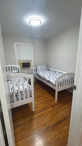 a bedroom with furniture and a window