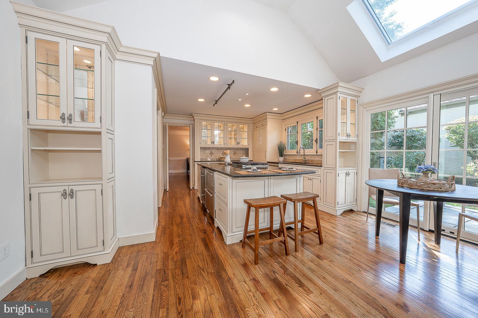 447 Inveraray Road Villanova, PA 19085 - Photo 13 of 71 a kitchen with stainless steel appliances granite countertop wooden floors and table
