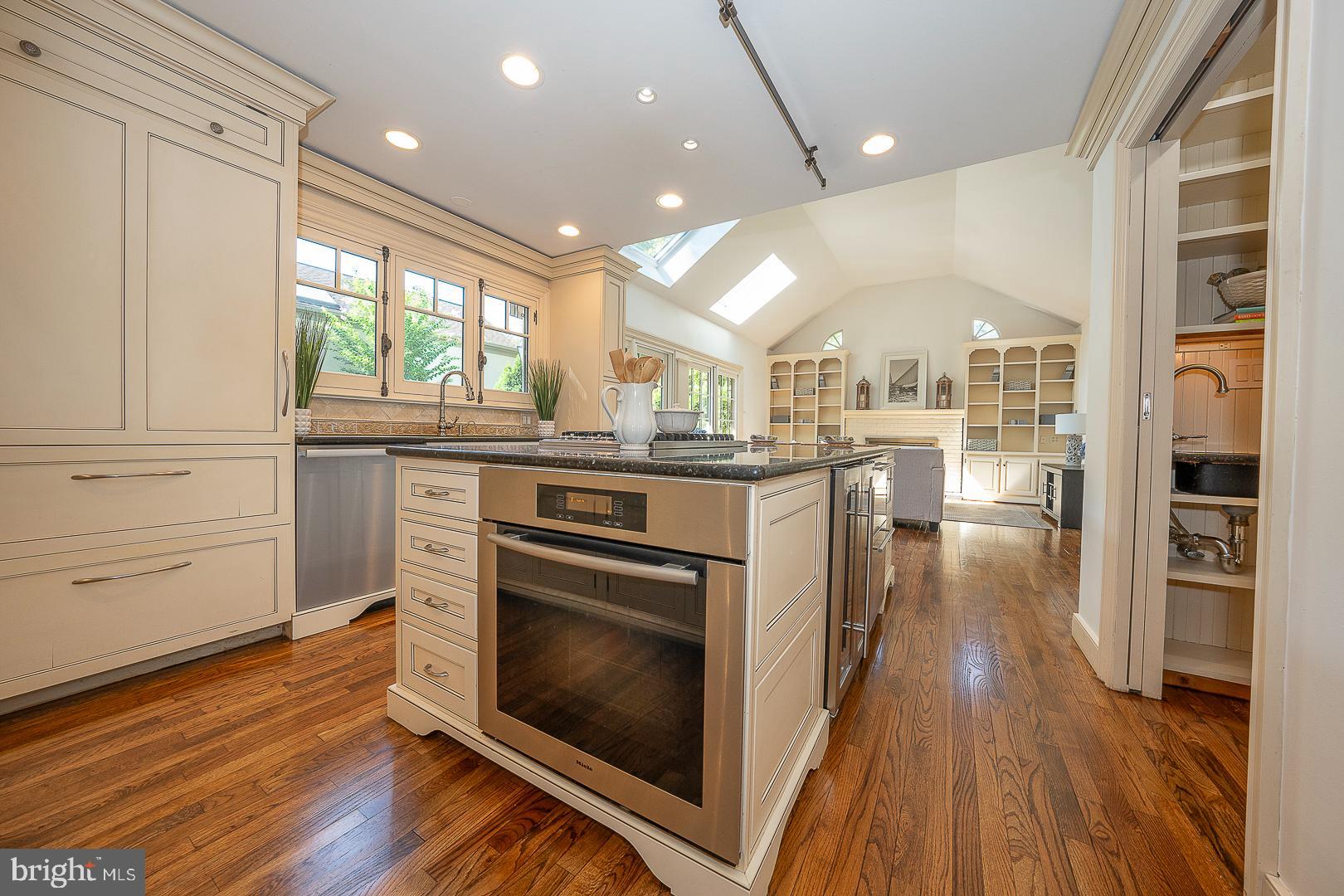 447 Inveraray Road Villanova, PA 19085 - Photo 17 of 71 a kitchen with stainless steel appliances granite countertop a stove cabinets and wooden floor