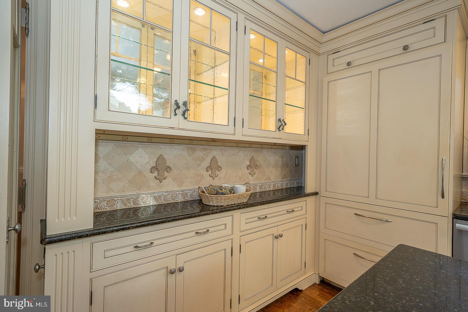 447 Inveraray Road Villanova, PA 19085 - Photo 19 of 71 a kitchen with granite countertop white cabinets and windows
