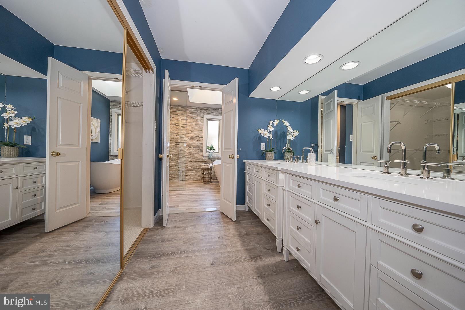 447 Inveraray Road Villanova, PA 19085 - Photo 28 of 71 a spacious bathroom with a granite countertop sink mirror and a