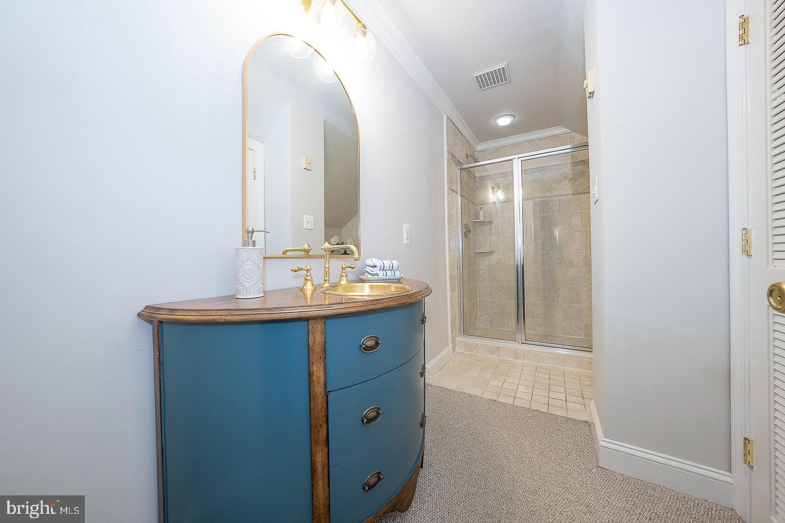 447 Inveraray Road Villanova, PA 19085 - Photo 38 of 71 a bathroom with a double vanity sink and mirror