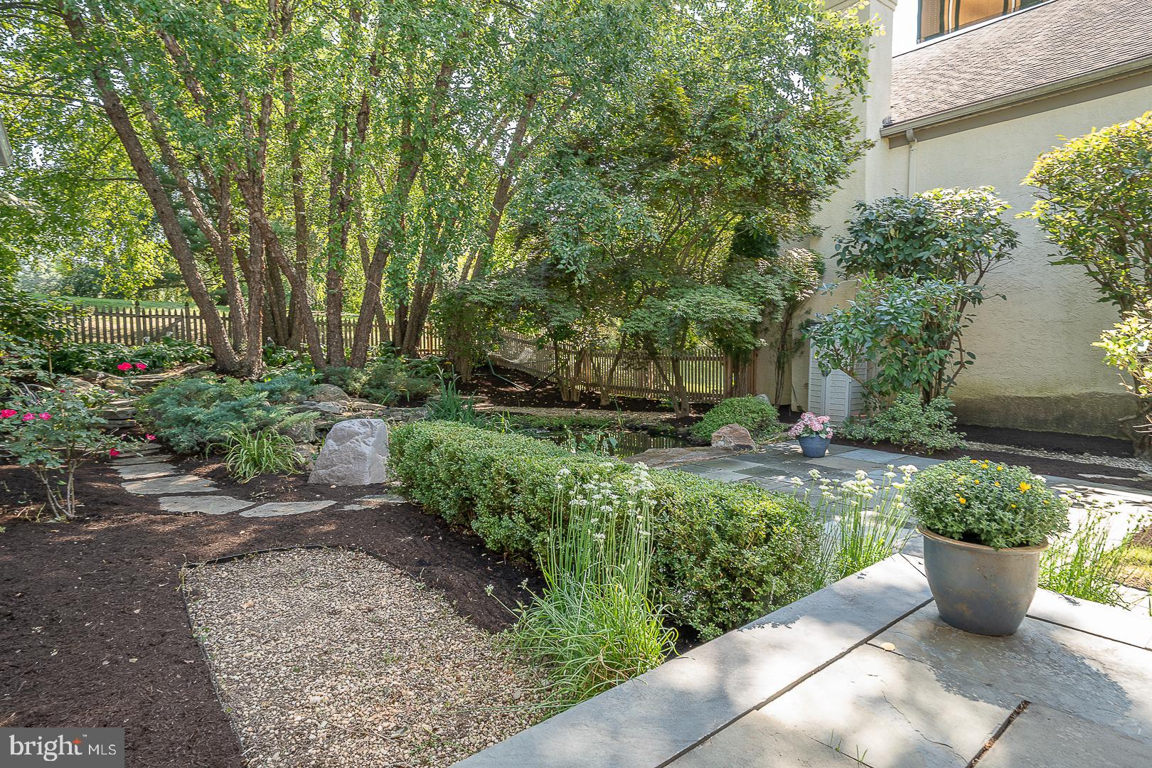 447 Inveraray Road Villanova, PA 19085 - Photo 65 of 71 a view of a backyard with patio and potted plants