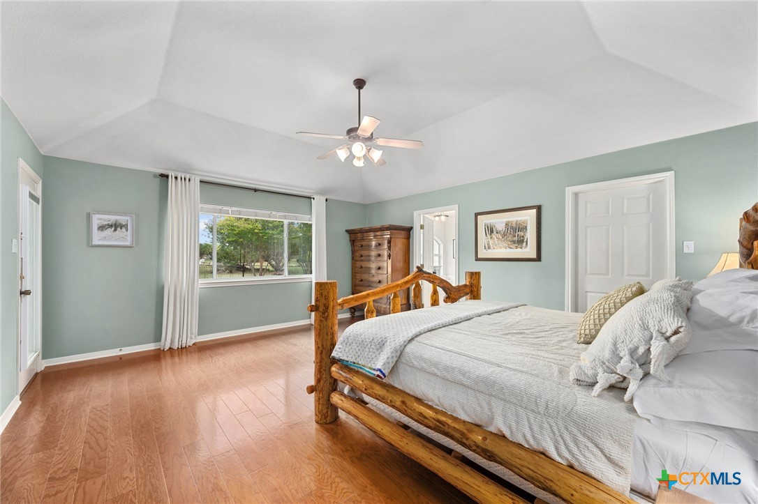 106 Starlight Trail Georgetown, TX 78633 - Photo 21 of 47 Primary Bedroom - Spacious with Wood flooring and Coffered Ceiling.