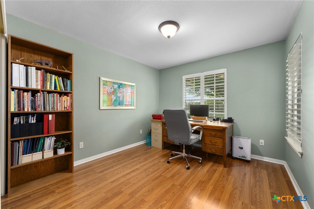 106 Starlight Trail Georgetown, TX 78633 - Photo 25 of 47 Office/Study - Closet and wood flooring