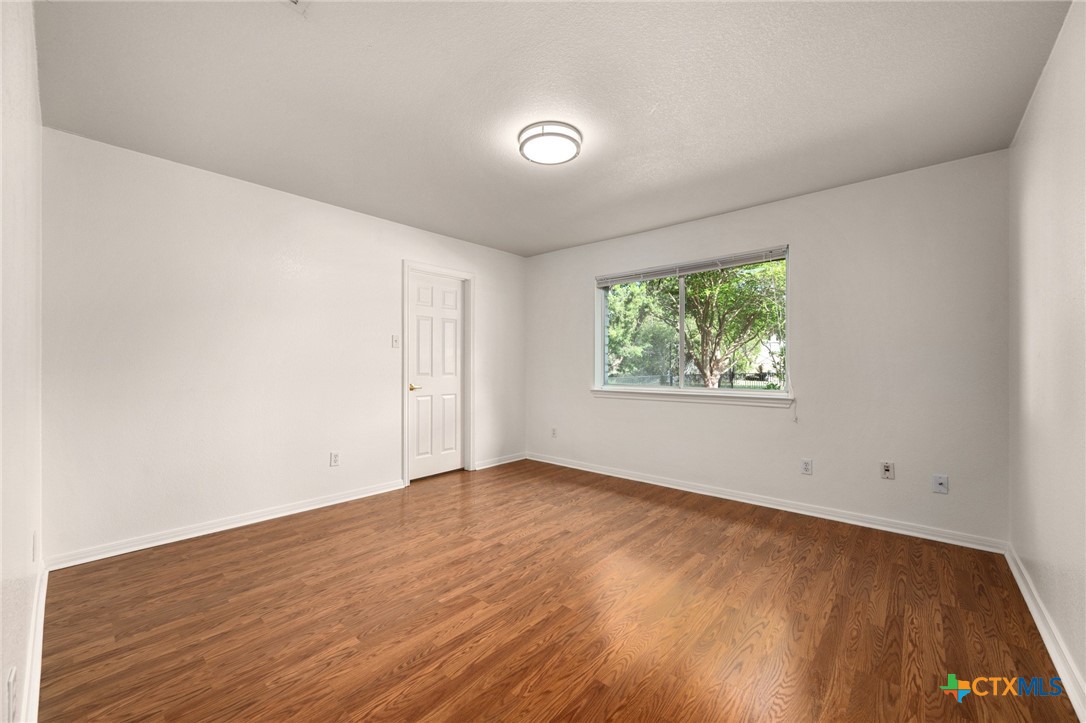 106 Starlight Trail Georgetown, TX 78633 - Photo 27 of 47 2nd Bedroom - Wood floors and Walk-in closet