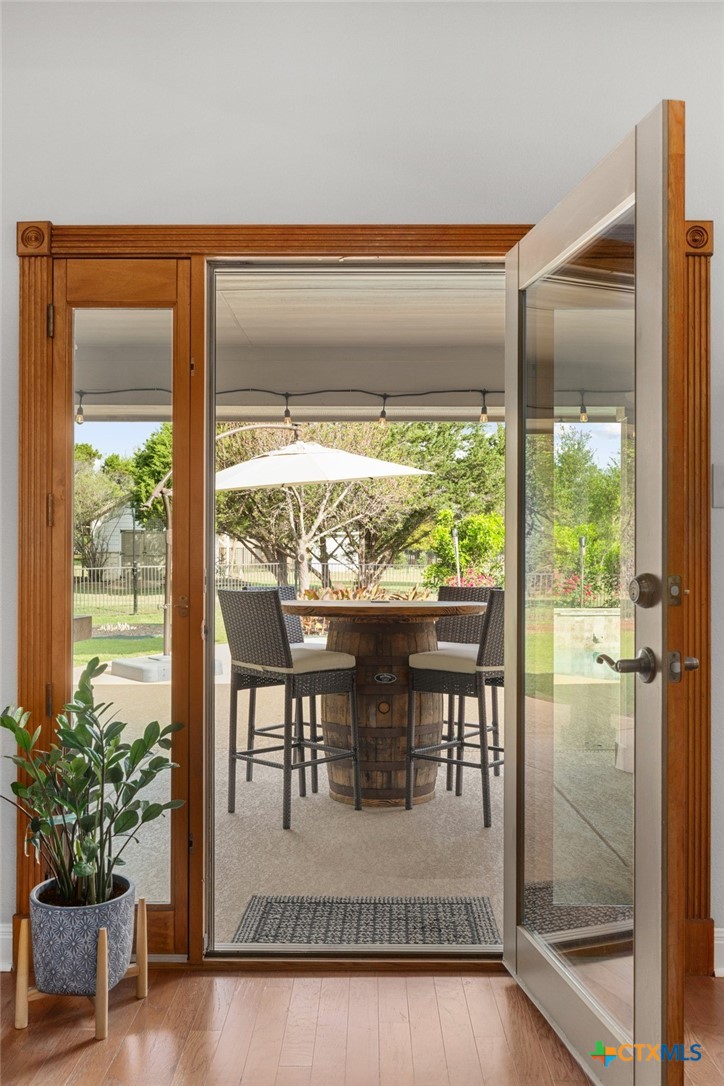 106 Starlight Trail Georgetown, TX 78633 - Photo 32 of 47 Wood Casement Door and Windows that open to the patio.