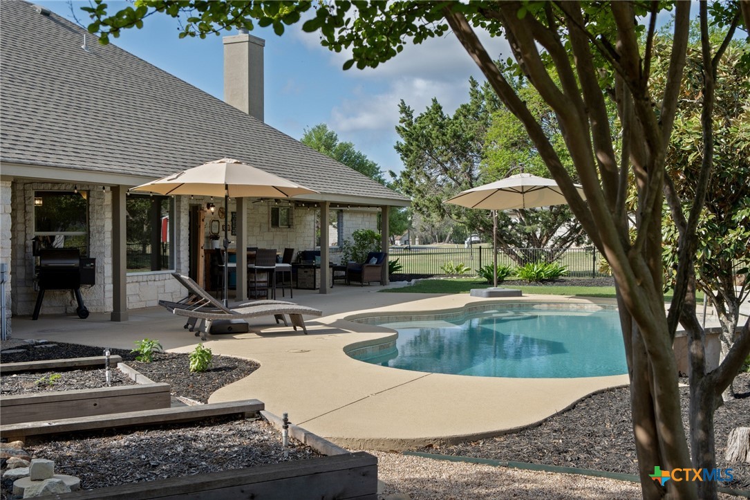 106 Starlight Trail Georgetown, TX 78633 - Photo 39 of 47 Extended Patio - Covered Porch and Sparkling Pool.