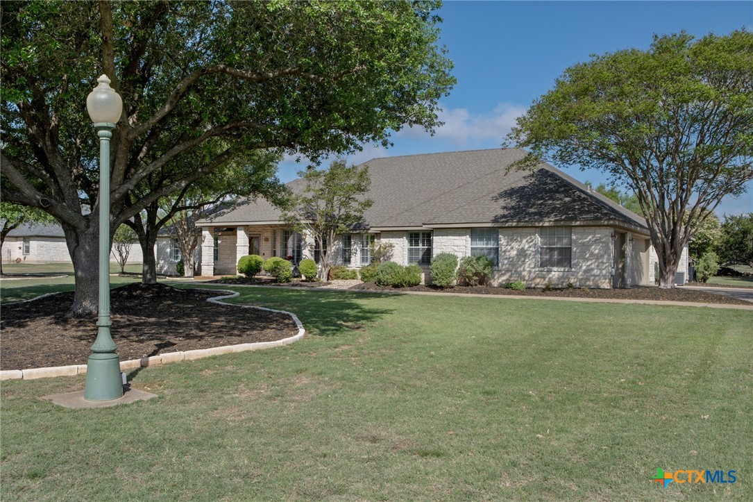 106 Starlight Trail Georgetown, TX 78633 - Photo 4 of 47 Beautiful mature trees and landscaping.