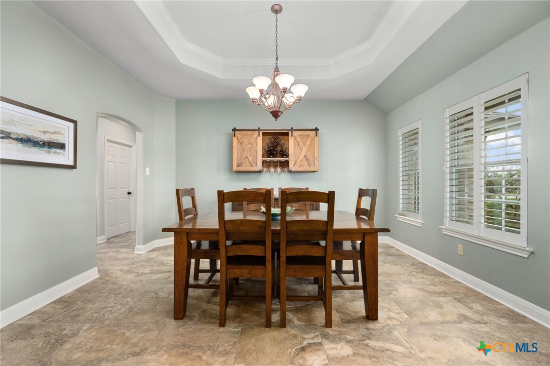 106 Starlight Trail Georgetown, TX 78633 - Photo 10 of 47 Dining Room - Tray Ceiling - Custom Shutters.