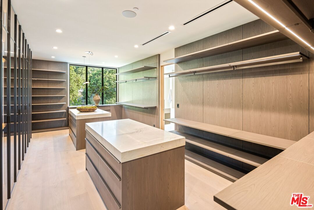 17055 Rancho Street Encino, CA 91316 - Photo 58 of 73 a kitchen with a sink and a refrigerator