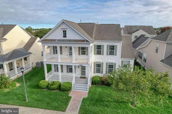 an aerial view of a house with a big yard