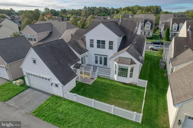 an aerial view of a house with a big yard