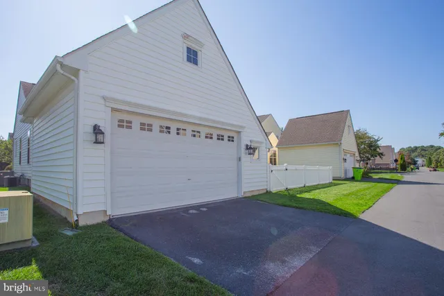 a view of lake with residential houses with outdoor space and trees