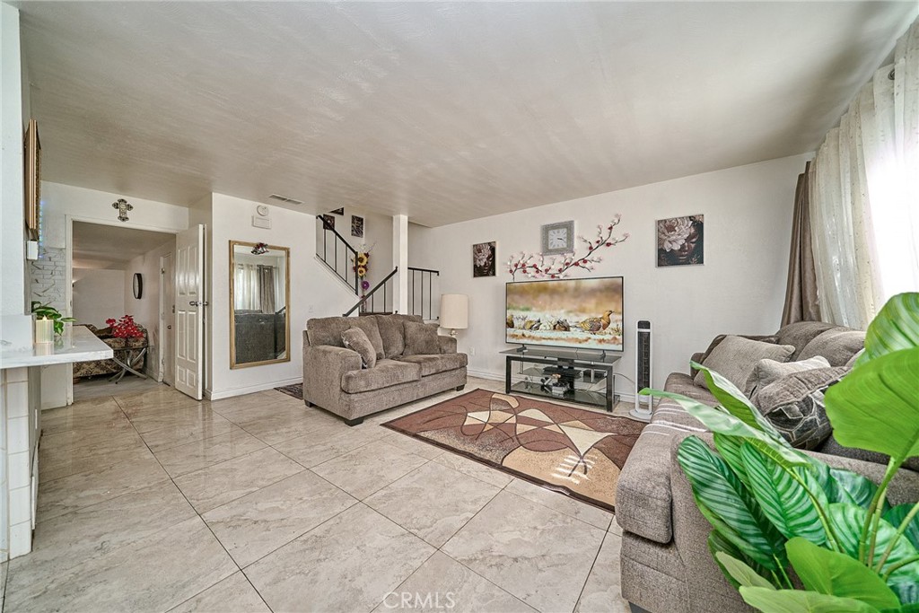 4801 Jackson Street, Unit C Riverside, CA 92503 - Photo 11 of 56 a living room with furniture and a flat screen tv