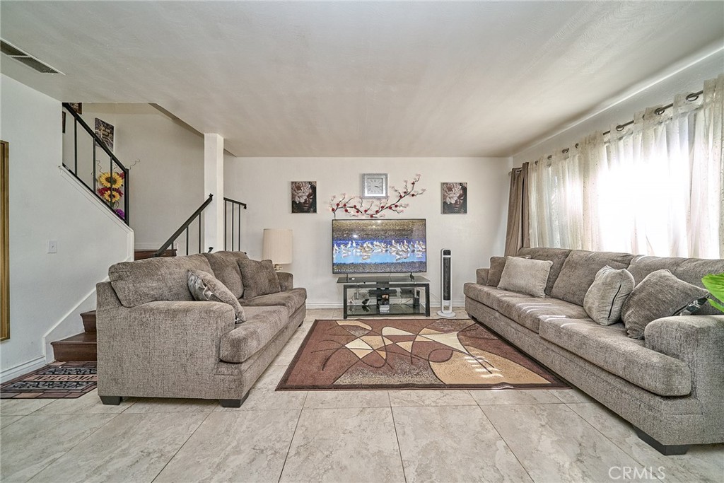 4801 Jackson Street, Unit C Riverside, CA 92503 - Photo 8 of 56 a living room with furniture and a fireplace