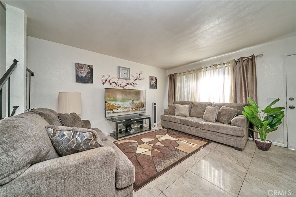 4801 Jackson Street, Unit C Riverside, CA 92503 - Photo 9 of 56 a living room with furniture and a flat screen tv