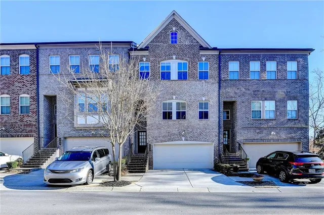a view of a brick building with many windows