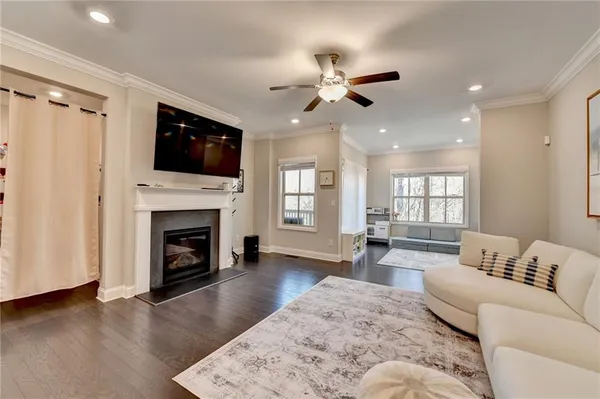 a view of a hallway with wooden floor and entryway