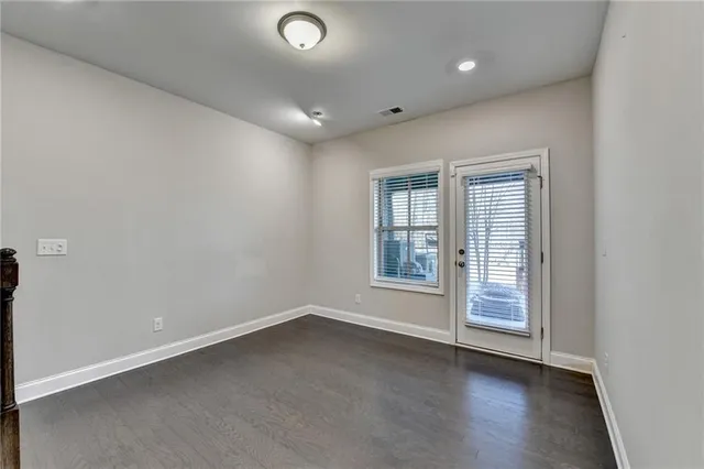 a view of room with a furniture and wooden floor