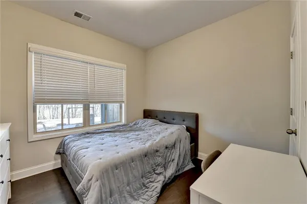 a view of a balcony with wooden floor and fence