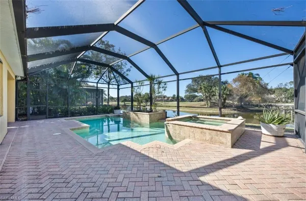 a view of a swimming pool with a patio