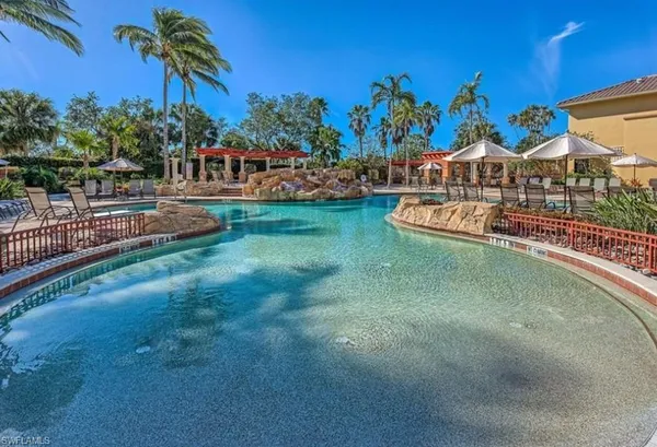 a view of swimming pool with outdoor seating