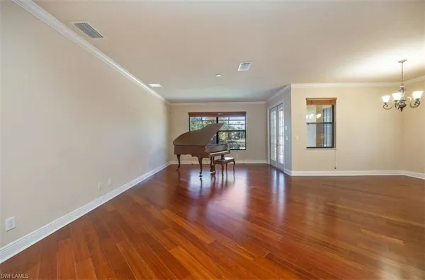 a view of a livingroom with furniture hardwood floor and floors