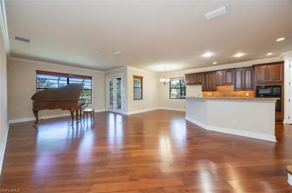 a view of kitchen with wooden floor and outdoor seating