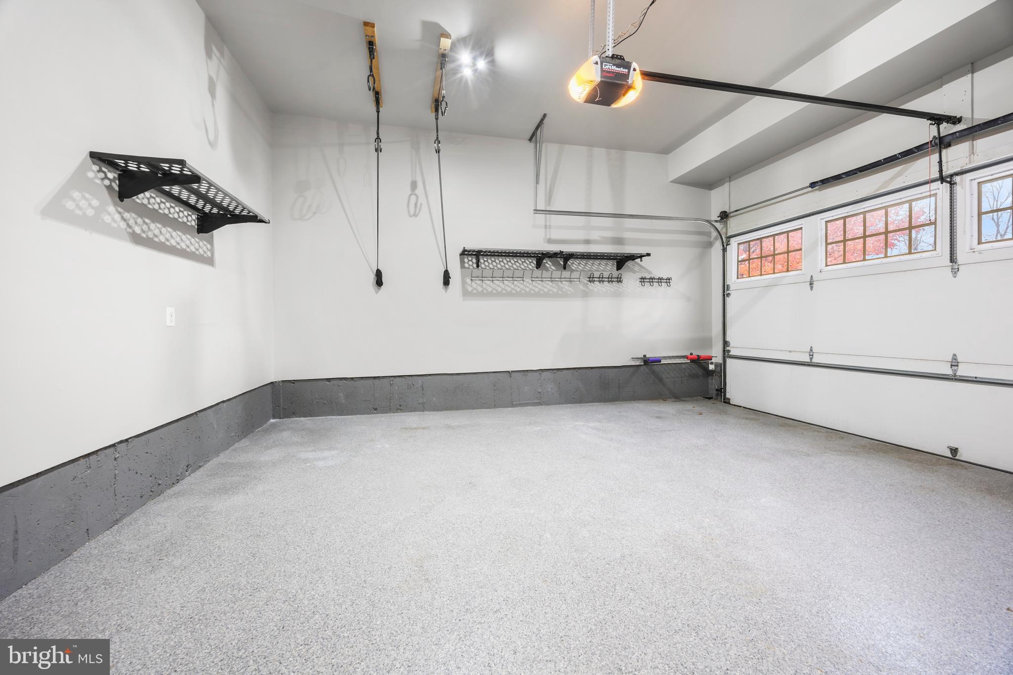 8047 Fairfax Road Alexandria, VA 22308 - Photo 62 of 70 Two Car Garage w/ Epoxy Flooring and Tall Ceiling
