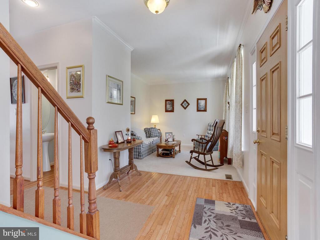 4320 Dunn Road Huntingtown, MD 20639 - Photo 31 of 47 Foyer w/Hardwood Floors and crown molding