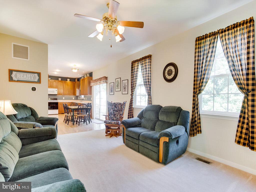 4320 Dunn Road Huntingtown, MD 20639 - Photo 35 of 47 Family Room w/Ceiling Fan & Door to Covered Porch