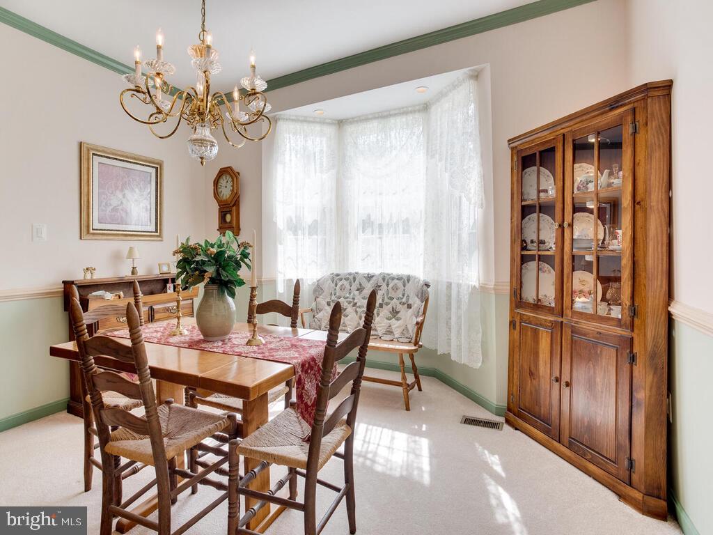 4320 Dunn Road Huntingtown, MD 20639 - Photo 36 of 47 Dining Room with Chair & Crown Molding