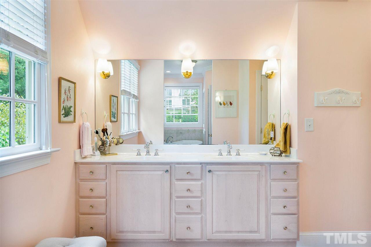 3201 Landor Road Raleigh, NC 27609 - Photo 13 of 25 a bathroom with a double vanity sink and a mirror