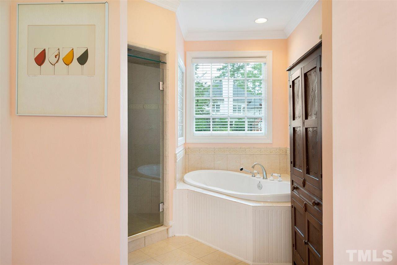 3201 Landor Road Raleigh, NC 27609 - Photo 14 of 25 a white bath tub sitting next to a white sink