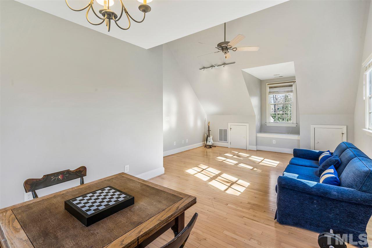 3201 Landor Road Raleigh, NC 27609 - Photo 18 of 25 a bedroom with furniture and a table