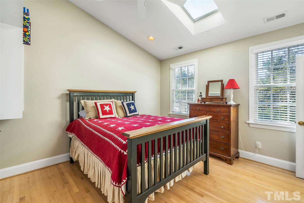 3201 Landor Road Raleigh, NC 27609 - Photo 22 of 25 a bedroom with a bed and a window
