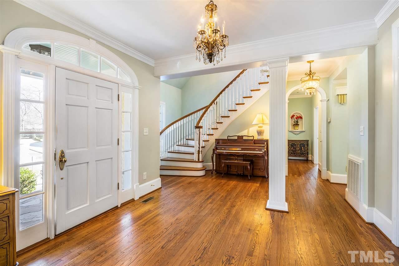 3201 Landor Road Raleigh, NC 27609 - Photo 4 of 25 a view of entryway and hall with wooden floor