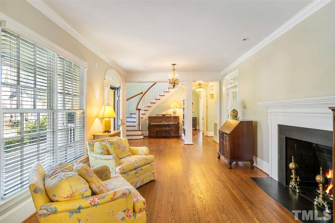 3201 Landor Road Raleigh, NC 27609 - Photo 6 of 25 a living room with furniture and a fireplace