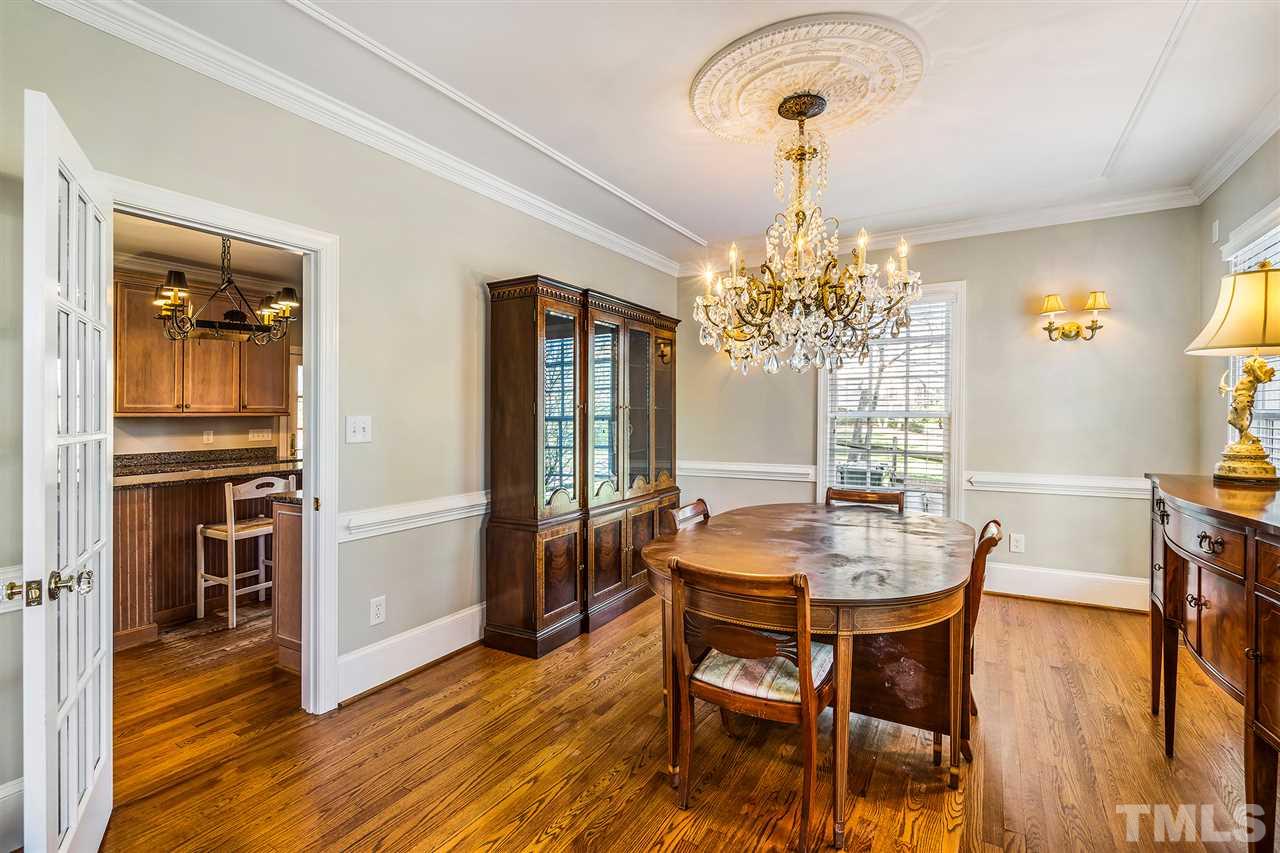3201 Landor Road Raleigh, NC 27609 - Photo 7 of 25 a view of a dining room with furniture and wooden floor