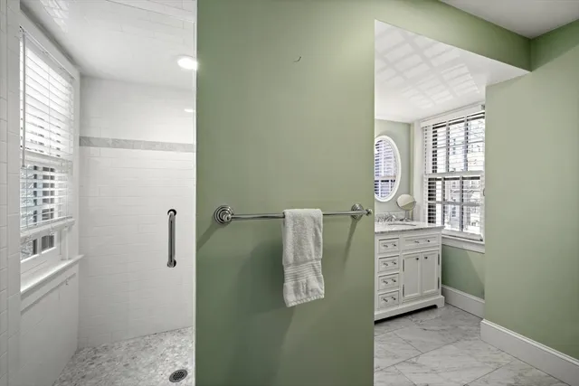 a room with windows and cabinet